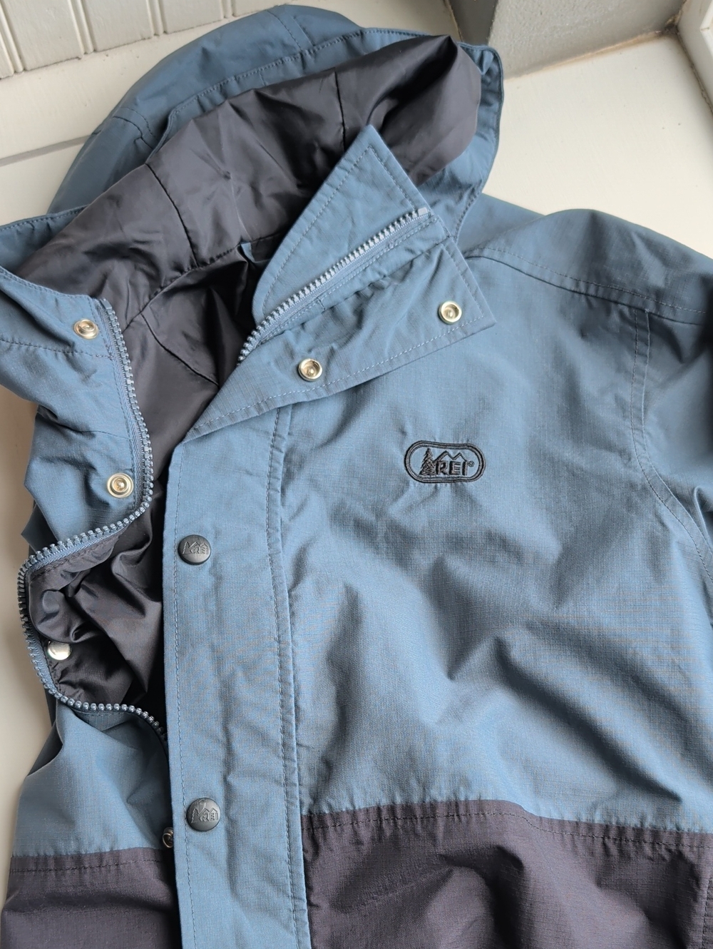 REI Kids Blue and Dark Blue Hooded Rain Jacket